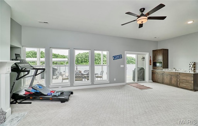 10234 Village Dr, Foristell, MO 63348 - workout area with light colored carpet, ceiling fan, and recessed lighting