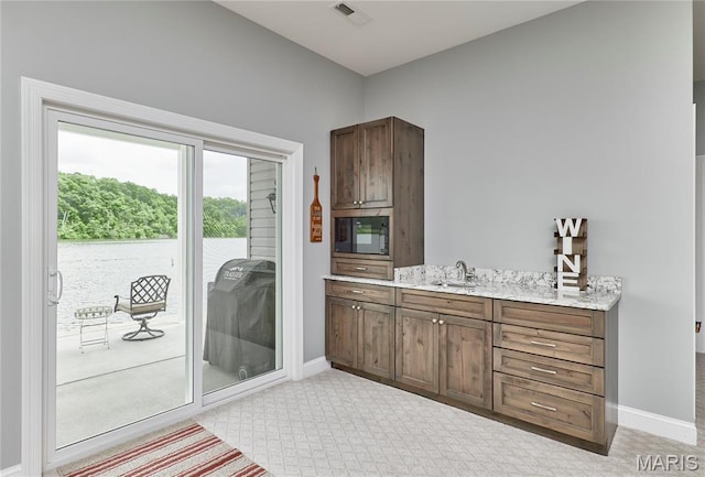 10234 Village Dr, Foristell, MO 63348 - bathroom with baseboards and vanity