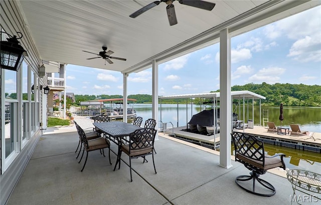 10234 Village Dr, Foristell, MO 63348 - sunroom / solarium with ceiling fan, expansive windows, and a water view