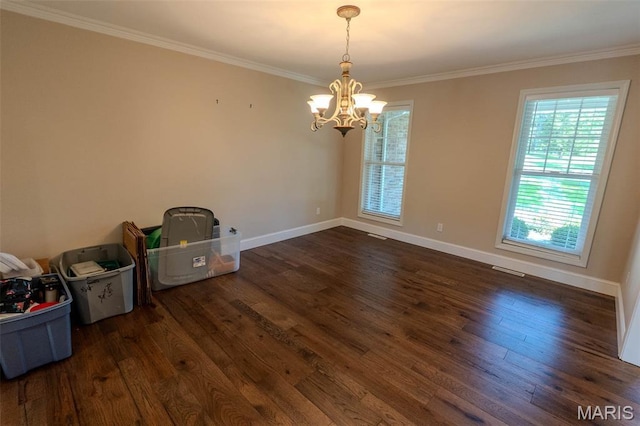 11782 Pine Forest Dr, Rolla, MO 65401 - spare room featuring crown molding, a chandelier, and dark wood-style floors