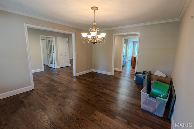 11782 Pine Forest Dr, Rolla, MO 65401 - unfurnished dining area featuring a chandelier, ornamental molding, and dark wood-type flooring