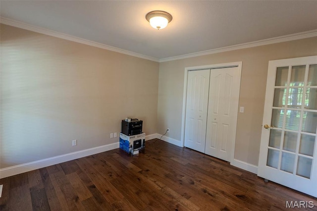 11782 Pine Forest Dr, Rolla, MO 65401 - unfurnished bedroom with ornamental molding, dark wood-style flooring, and a closet