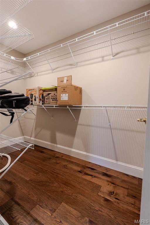 11782 Pine Forest Dr, Rolla, MO 65401 - walk in closet featuring wood finished floors