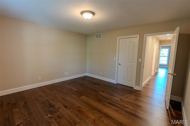 11782 Pine Forest Dr, Rolla, MO 65401 - unfurnished room featuring dark wood-style floors and baseboards