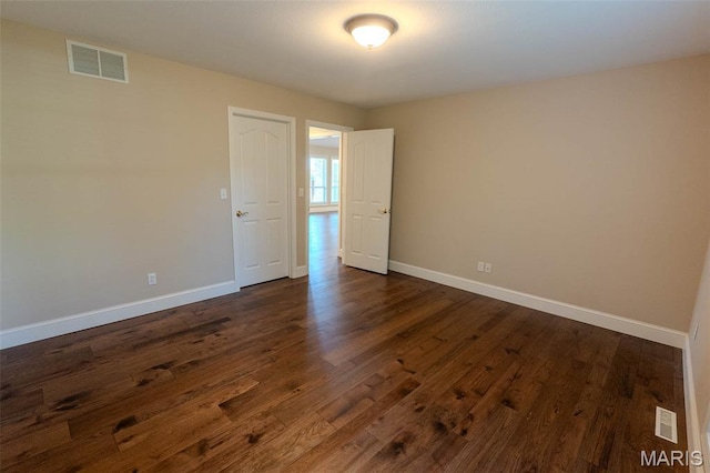 11782 Pine Forest Dr, Rolla, MO 65401 - empty room with baseboards and dark wood-type flooring