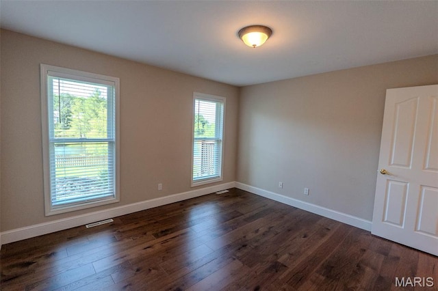 11782 Pine Forest Dr, Rolla, MO 65401 - unfurnished room with dark wood-style flooring and baseboards