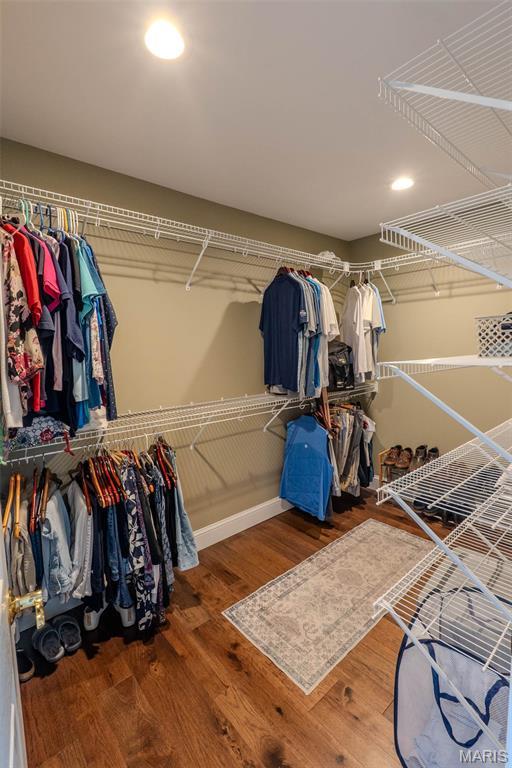 11782 Pine Forest Dr, Rolla, MO 65401 - walk in closet featuring wood finished floors