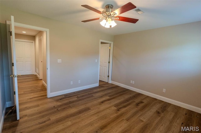 11782 Pine Forest Dr, Rolla, MO 65401 - spare room featuring wood finished floors and a ceiling fan