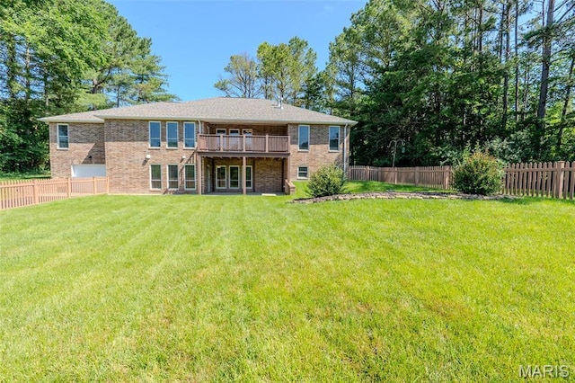 11782 Pine Forest Dr, Rolla, MO 65401 - back of property with brick siding, a fenced backyard, and a deck