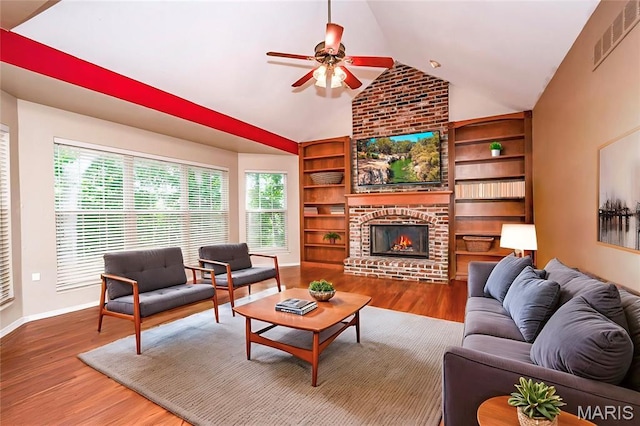 742 Arbor Ridge Ct, Ballwin, MO 63021 - living area with ceiling fan, a fireplace, wood finished floors, built in features, and high vaulted ceiling