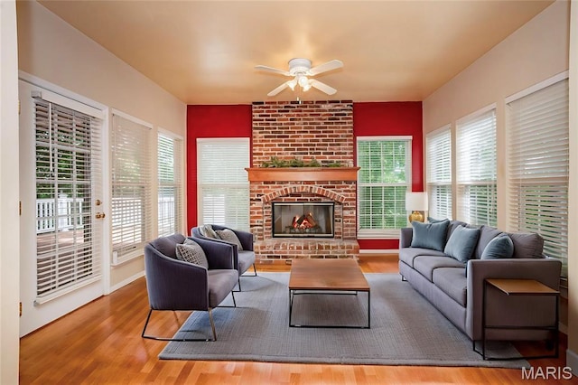 742 Arbor Ridge Ct, Ballwin, MO 63021 - living room with ceiling fan, wood finished floors, and a fireplace