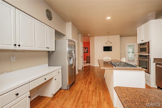 742 Arbor Ridge Ct, Ballwin, MO 63021 - kitchen with appliances with stainless steel finishes, built in desk, light wood-style floors, white cabinetry, and recessed lighting