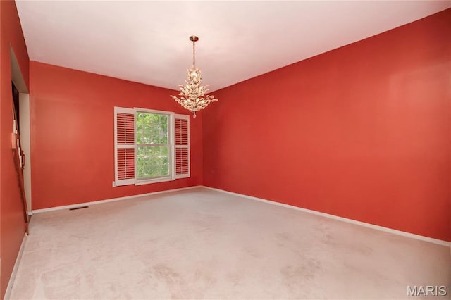 742 Arbor Ridge Ct, Ballwin, MO 63021 - empty room with a chandelier and carpet floors