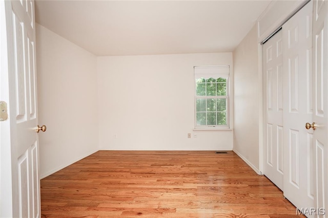 742 Arbor Ridge Ct, Ballwin, MO 63021 - unfurnished bedroom with light wood-style flooring and a closet