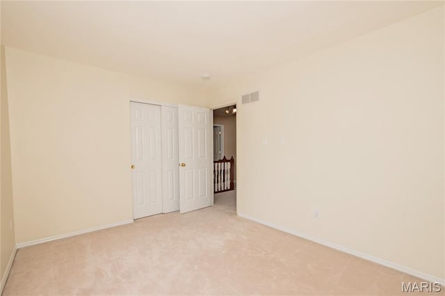 742 Arbor Ridge Ct, Ballwin, MO 63021 - unfurnished bedroom with light carpet and a closet
