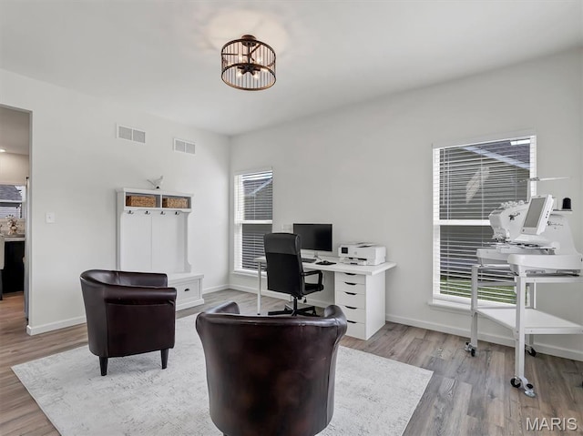 1673 Lake Meade Dr, Pacific, MO 63069 - home office featuring wood finished floors and a chandelier