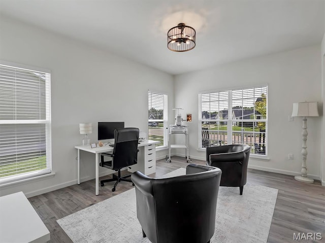 1673 Lake Meade Dr, Pacific, MO 63069 - office area featuring wood finished floors and a chandelier