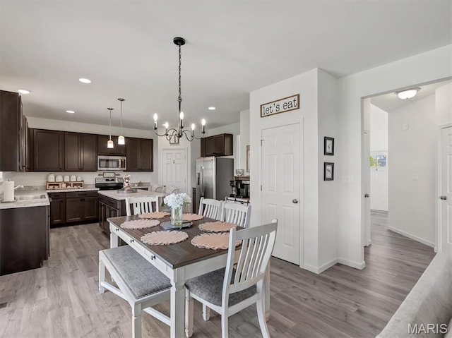 1673 Lake Meade Dr, Pacific, MO 63069 - dining room featuring light wood-style flooring, a chandelier, and recessed lighting