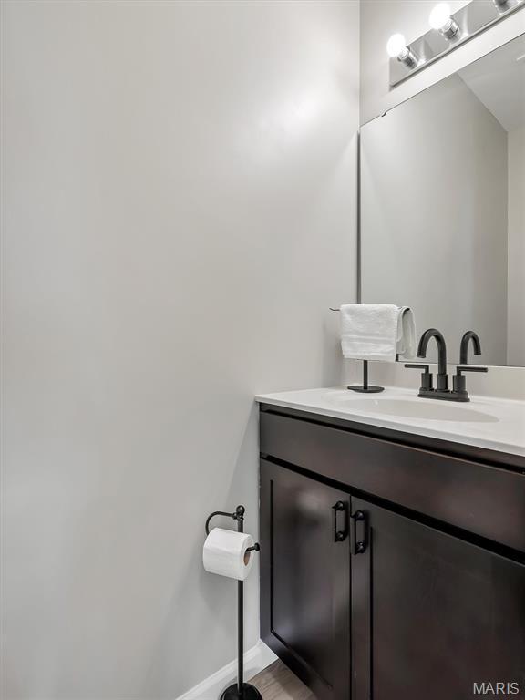 1673 Lake Meade Dr, Pacific, MO 63069 - bathroom featuring vanity and wood finished floors