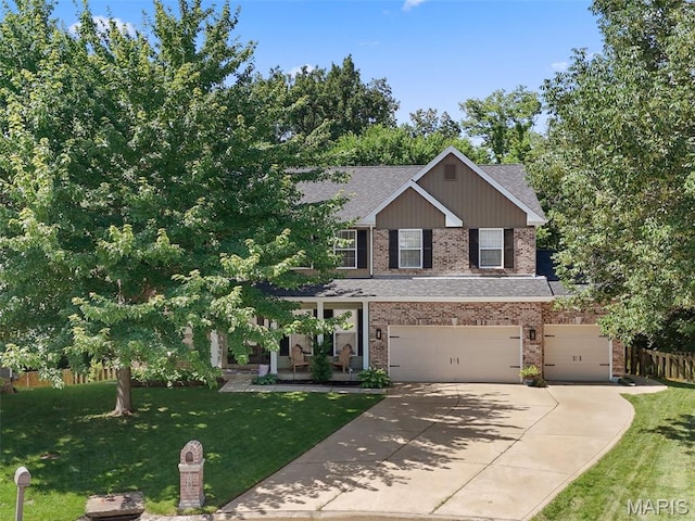 10 Renaud Pass, Ofallon, MO 63366 - view of front of property with brick siding, an attached garage, a shingled roof, and driveway