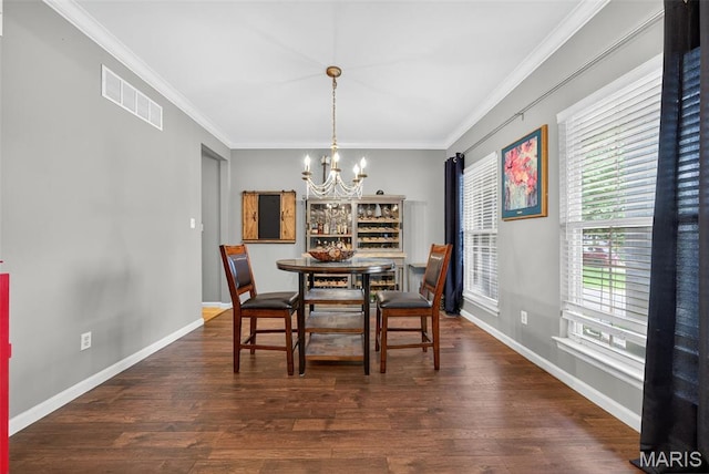 10 Renaud Pass, Ofallon, MO 63366 - dining area with a chandelier, wood finished floors, and crown molding
