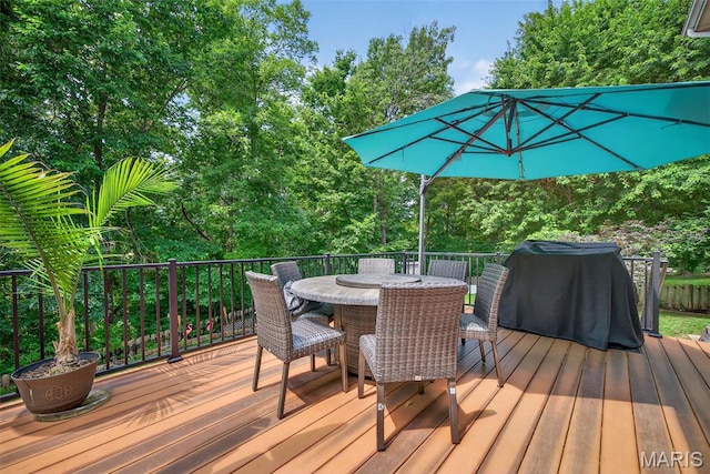 10 Renaud Pass, Ofallon, MO 63366 - wooden terrace featuring outdoor dining area, area for grilling, and view of scattered trees