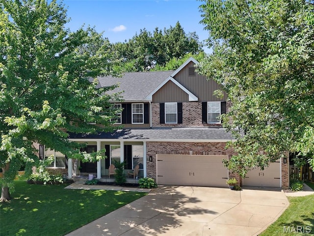 10 Renaud Pass, Ofallon, MO 63366 - view of front of property featuring brick siding, driveway, a front yard, and roof with shingles