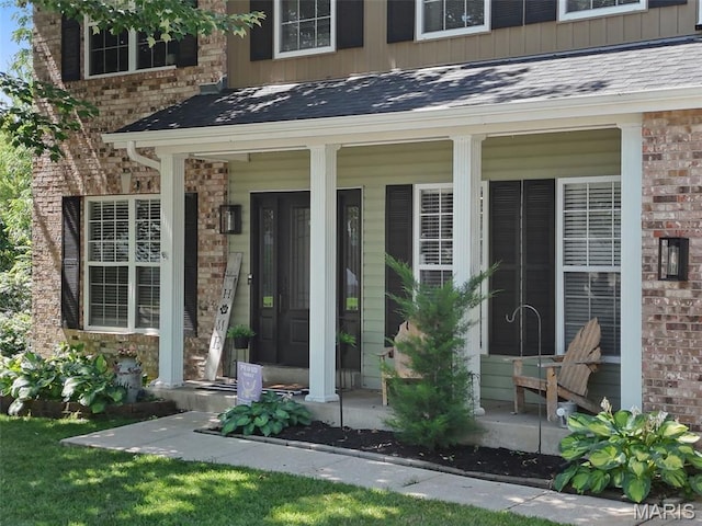 10 Renaud Pass, Ofallon, MO 63366 - property entrance with a porch, brick siding, and board and batten siding