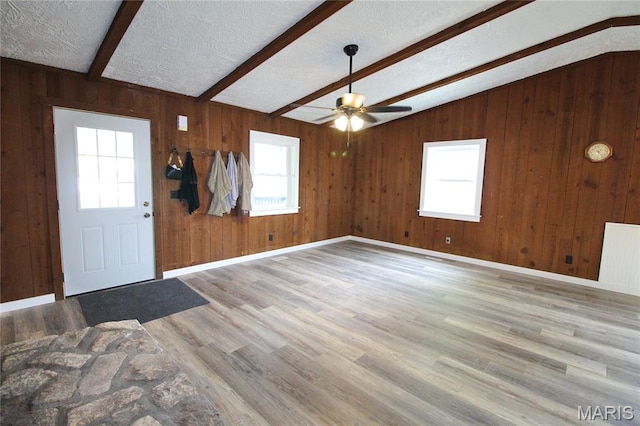 14525 Meadowlark Ln, Saint Genevieve, MO 63670 - foyer entrance with a ceiling fan, wood finished floors, wooden walls, and a textured ceiling
