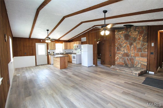 14525 Meadowlark Ln, Saint Genevieve, MO 63670 - kitchen with white appliances, a ceiling fan, wood walls, open floor plan, and light wood finished floors