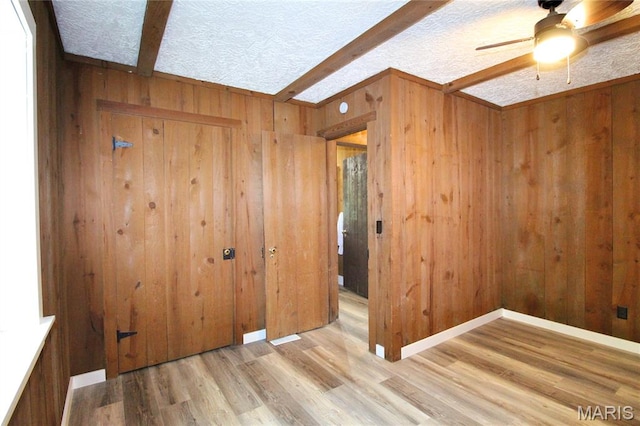 14525 Meadowlark Ln, Saint Genevieve, MO 63670 - empty room featuring ceiling fan, wooden walls, and wood finished floors
