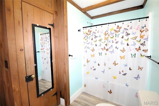 14525 Meadowlark Ln, Saint Genevieve, MO 63670 - bathroom with wood finished floors and shower / bath combo with shower curtain
