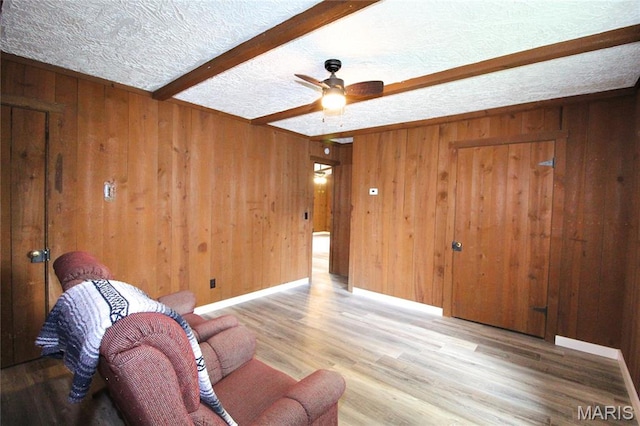 14525 Meadowlark Ln, Saint Genevieve, MO 63670 - unfurnished room featuring wooden walls, wood finished floors, ceiling fan, and beam ceiling