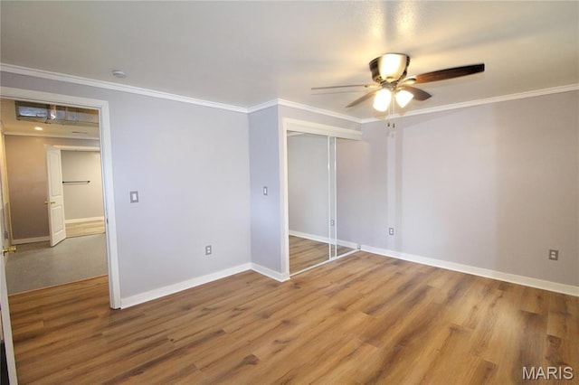14525 Meadowlark Ln, Saint Genevieve, MO 63670 - unfurnished bedroom featuring crown molding, wood finished floors, and a ceiling fan