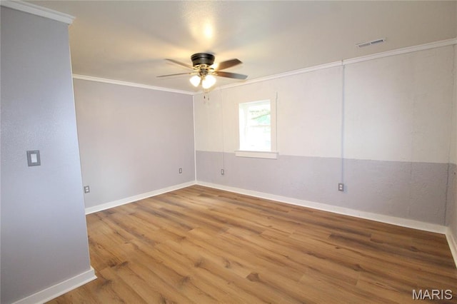 14525 Meadowlark Ln, Saint Genevieve, MO 63670 - empty room featuring ceiling fan, wood finished floors, and crown molding