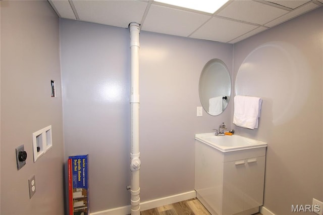 14525 Meadowlark Ln, Saint Genevieve, MO 63670 - bathroom featuring a drop ceiling, wood finished floors, and vanity