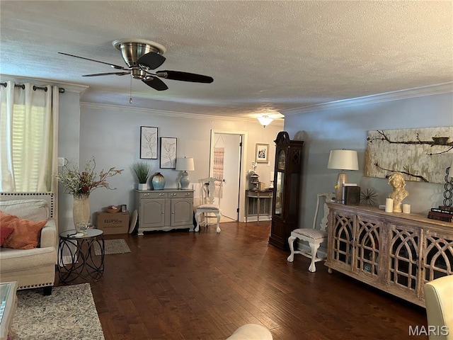301 W Clipper St, Kennett, MO 63857 - living room featuring a textured ceiling, ornamental molding, ceiling fan, and wood finished floors
