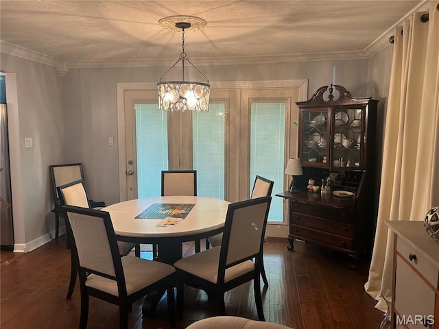 301 W Clipper St, Kennett, MO 63857 - dining space featuring a chandelier, dark wood-style flooring, and ornamental molding