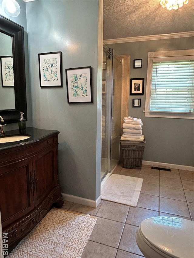 301 W Clipper St, Kennett, MO 63857 - full bathroom with vanity, tile patterned floors, ornamental molding, a stall shower, and a textured ceiling
