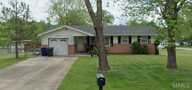 67 Strecker Rd, Ellisville, MO 63011 - ranch-style house with an attached garage, driveway, a front lawn, and brick siding