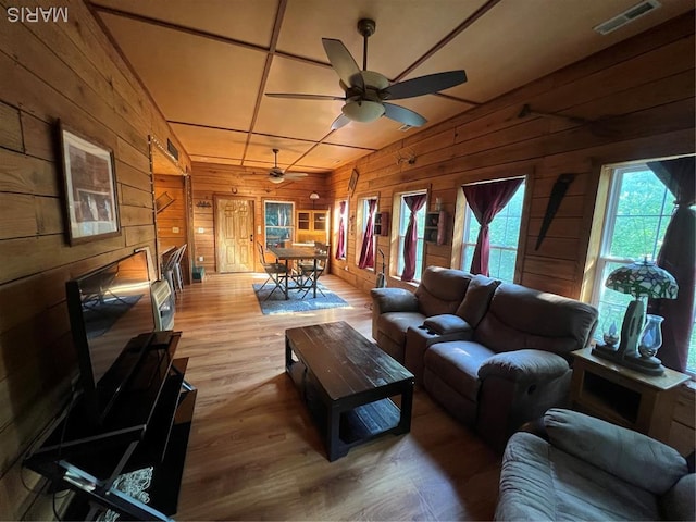 171 Bluffview Cir, Piedmont, MO 63957 - living room with wooden walls, wood finished floors, and a ceiling fan