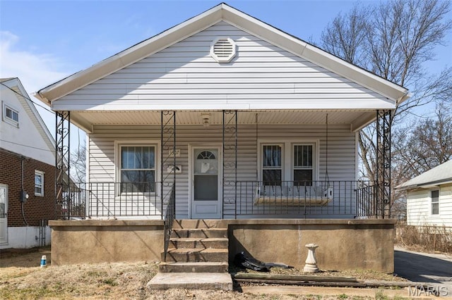 1307 Weleba Ave, Saint Louis, MO 63121 - shotgun-style home featuring covered porch