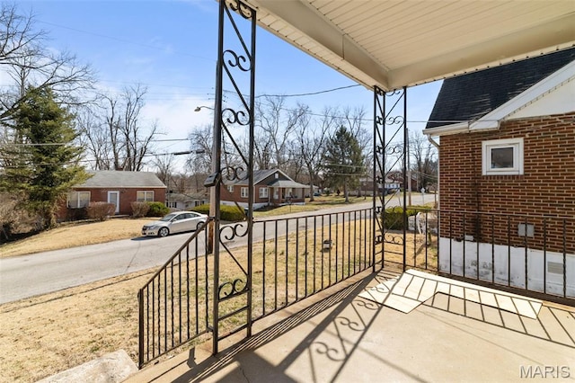 1307 Weleba Ave, Saint Louis, MO 63121 - porch featuring a residential view