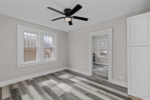 1307 Weleba Ave, Saint Louis, MO 63121 - spare room with wood finished floors and a ceiling fan