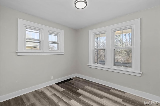 1307 Weleba Ave, Saint Louis, MO 63121 - empty room with baseboards and dark wood-style flooring