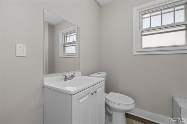 1307 Weleba Ave, Saint Louis, MO 63121 - bathroom featuring vanity and wood finished floors