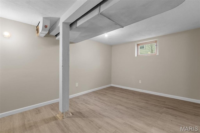1307 Weleba Ave, Saint Louis, MO 63121 - below grade area featuring wood finished floors and baseboards