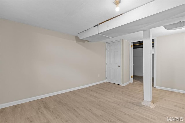 1307 Weleba Ave, Saint Louis, MO 63121 - finished below grade area with light wood-style flooring and baseboards