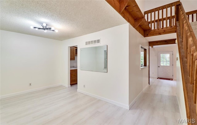 271 Westwood Trl, Foristell, MO 63348 - empty room featuring light wood-type flooring and a textured ceiling