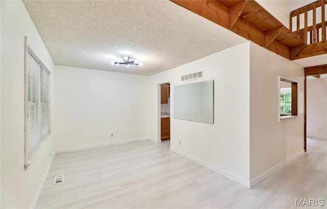 271 Westwood Trl, Foristell, MO 63348 - empty room featuring light wood-style flooring and a textured ceiling